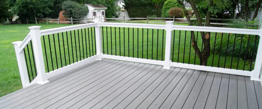 A composite deck featuring a combination of white and black railings, showcasing a modern design.
